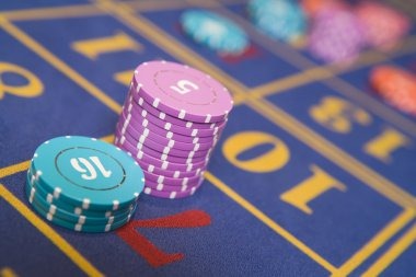 Mobile phone displaying live roulette table with dealer